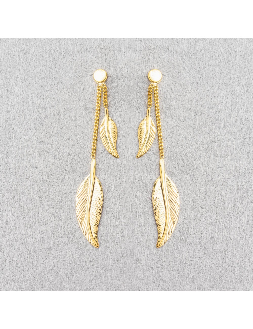 Boucle d'oreille double plumes.