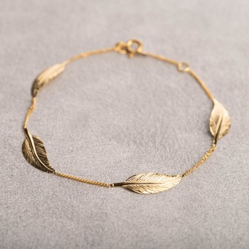 Bracelet femme quatre grosse plumes en or 9 carats.