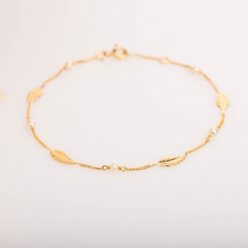 Bracelet femme plume et perle d'eau douce en or 18 carats.