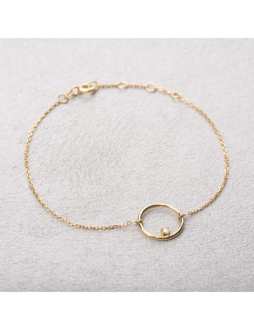 Bracelet femme fil rond sertie d'un diamant 0,03 carats en or 18 carats.