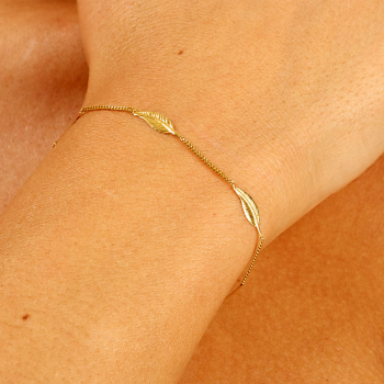 Bracelet femme cinq plumes en or 9 carats.